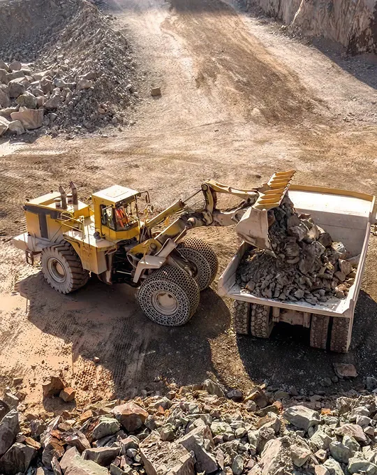 Large-scale ore mining extraction operations by Surbhi Earthmover